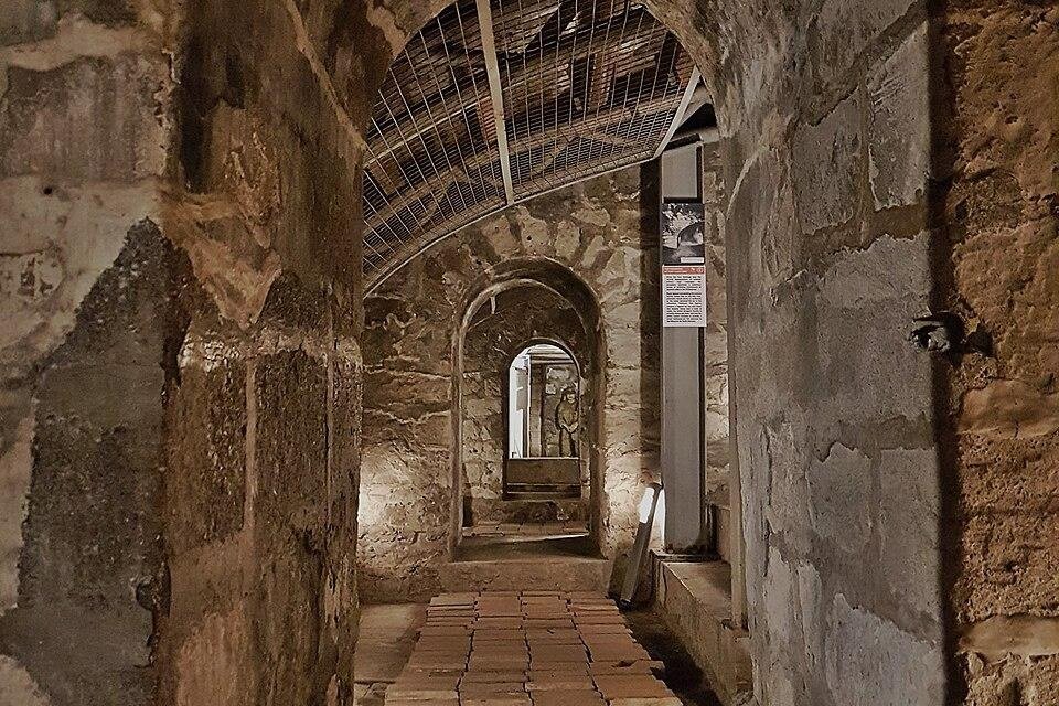 Old stone passage inside Fort Santiago in Intramuros, with arched doorways and brick flooring