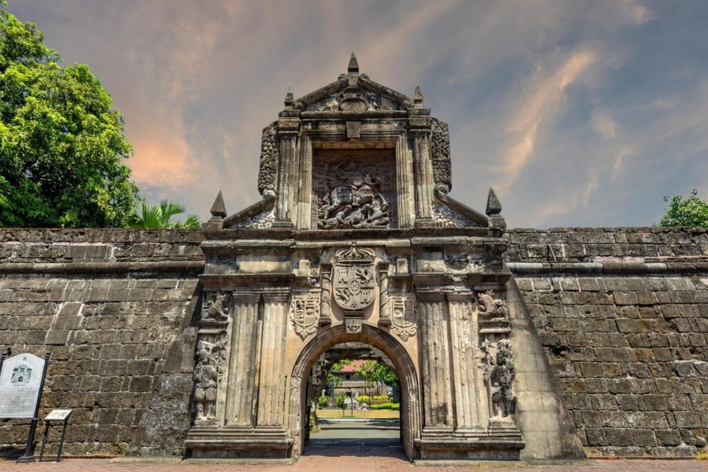 Historic stone entrance gate of Fort Santiago in Intramuros, Manila, with carved Spanish colonial details